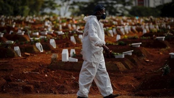 Worker prepares to receive more COVID-19 victims, Vila Formosa Cemetery, Sao Paulo, Brazil, May 28, 2021.