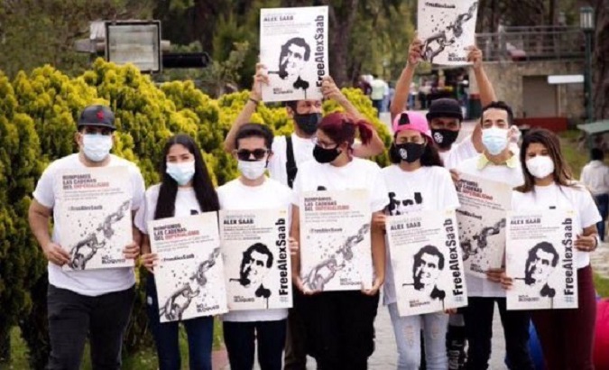 Young people hold a protest to demand the release of Alex Saab.