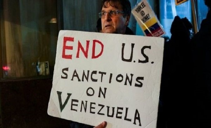A man protests US sanctions on Venezuela, U.S., Apr. 23, 2021.