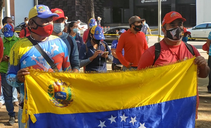 Venezuelans get ready to start an act in honor of the Carabobo Battle, June 24, 2021.