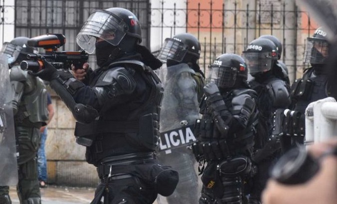 Members of the anti-riot squad take aim at demonstrators, Colombia, June, 2021.