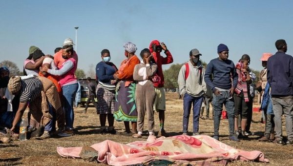 Family members grieve over the death of the victims of the protests, Johannesburg, South Africa, July 14, 2021. 