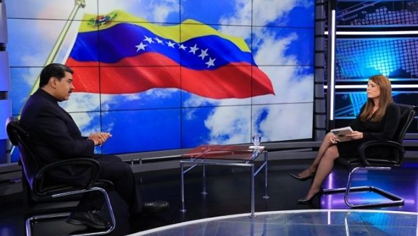 President Nicolas Maduro (L) talks with teleSur President Patricia Villegas (R), Caracas, Venezuela, Jul. 24, 2021.