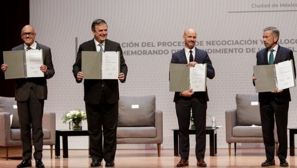 Participants in the dialogues show the agreements reached, Mexico City, Mexico, Aug. 2021.