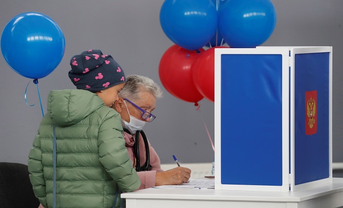 A woman casts her vote in St. Petersburg, Russia, Sept. 19, 2021.