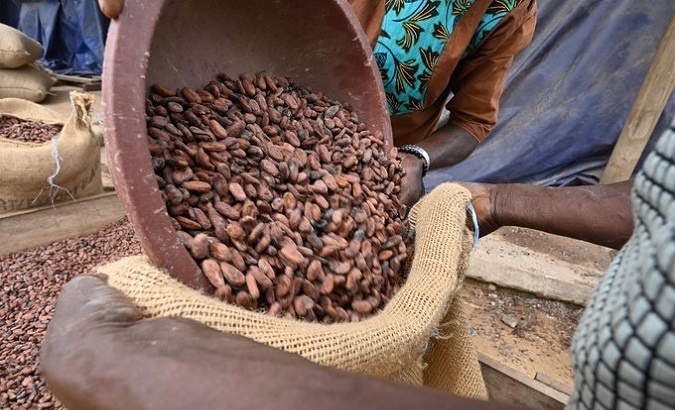 People trade coffee in an African market, 2021.