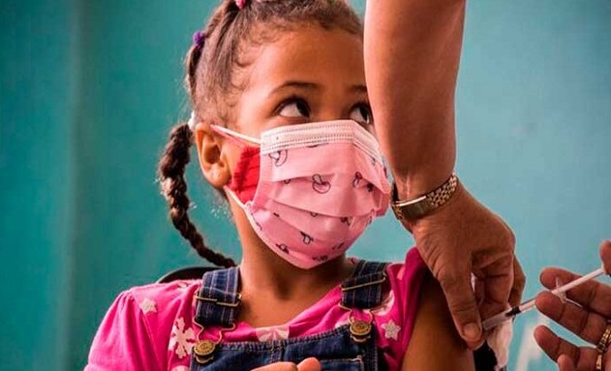 A girl gets a COVID-19 vaccine, Cuba, Oct. 11, 2021.