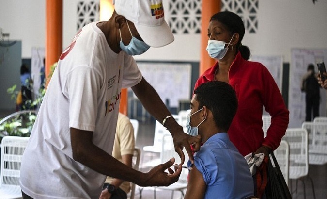 A man gets the Abdala COVID-19 vaccine, Venezuela, 2021.