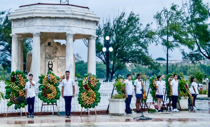 Students pay tribute at the 8 medicine students' monument in Havana, Cuba, Nov. 27, 2021.