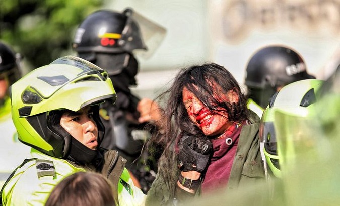 Colombian militarized police arrest a citizen during protests, Sep. 9, 2021.