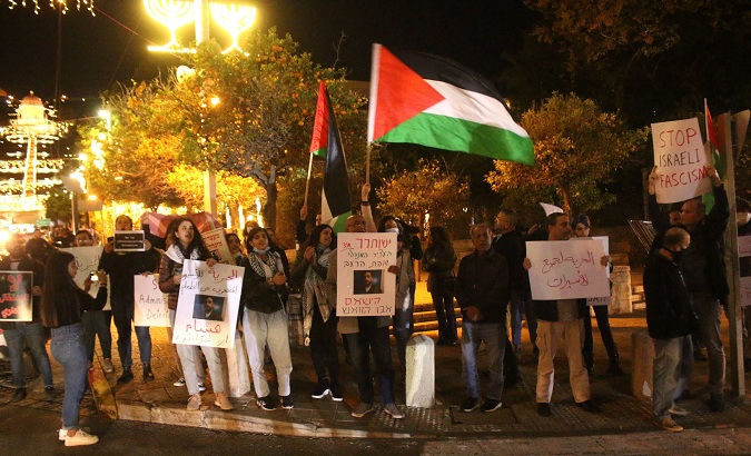 People protest in Haifa in support of Hisham Abu Hawash, Dec. 28, 2021.