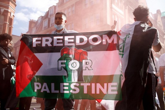 Demonstrators continue a 'Justice for Palestine' protest, part of the 'Resist G7 Day of Action for International Justice', outside the Israeli Embassy in London, Britain, on June 12, 2021.