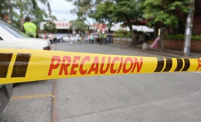 A warning tape prevents passage to the crime scene, Jamundi, Colombia, Jan. 3, 2021.