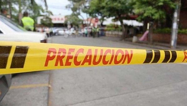A warning tape prevents passage to the crime scene, Jamundi, Colombia, Jan. 3, 2021. 