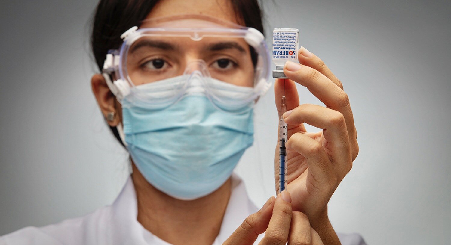 Health worker prepares the administration of a COVID-19 vaccine, Cuba, Jan. 19, 2022.