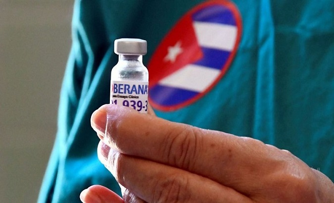 A pharmacist loads samples of the Sovereign Plus vaccine, Cuba.