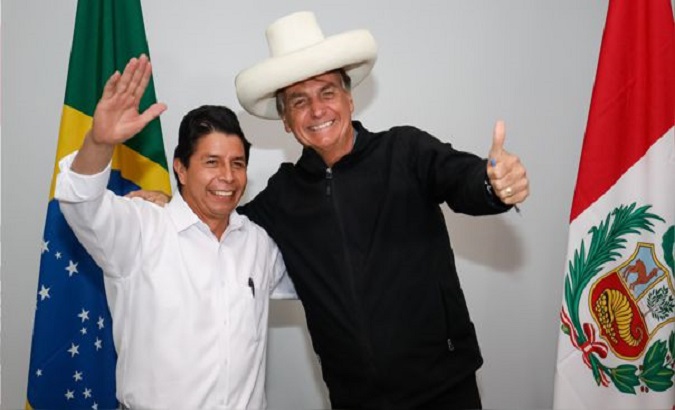 Peru's President Pedro Castillo (L) and President Jair Bolsonaro (R) in Porto Velho, Brazil, Feb. 3, 2022.