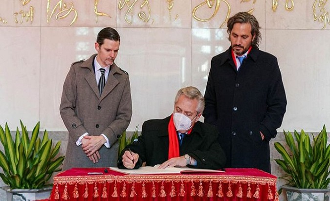 Argentina's President Alberto Fernandez (C) signs the Silk Road MoU, Beijing, China, Jan. 6, 2022.