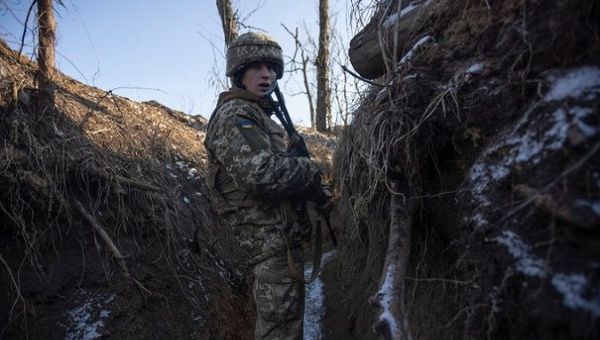 Ukrainian soldier in a trench near the border, Feb. 21, 2022.