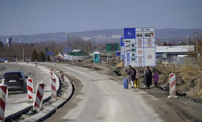 Ukrainians moving towards the Hungarian border, Feb. 25, 2022.