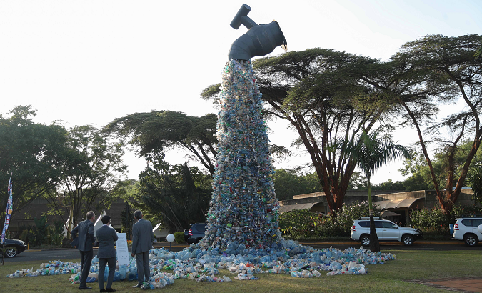 Art installation depicting plastic bottles flowing from a tap in Nairobi, Kenya, March 2, 2022.