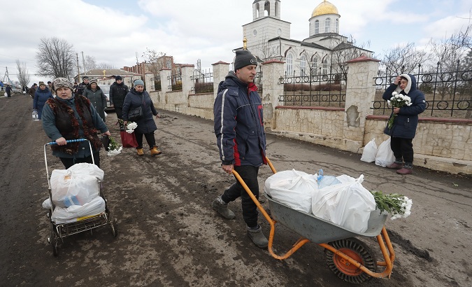 People receive humanitarian aid in Donetsk, March 6, 2022.
