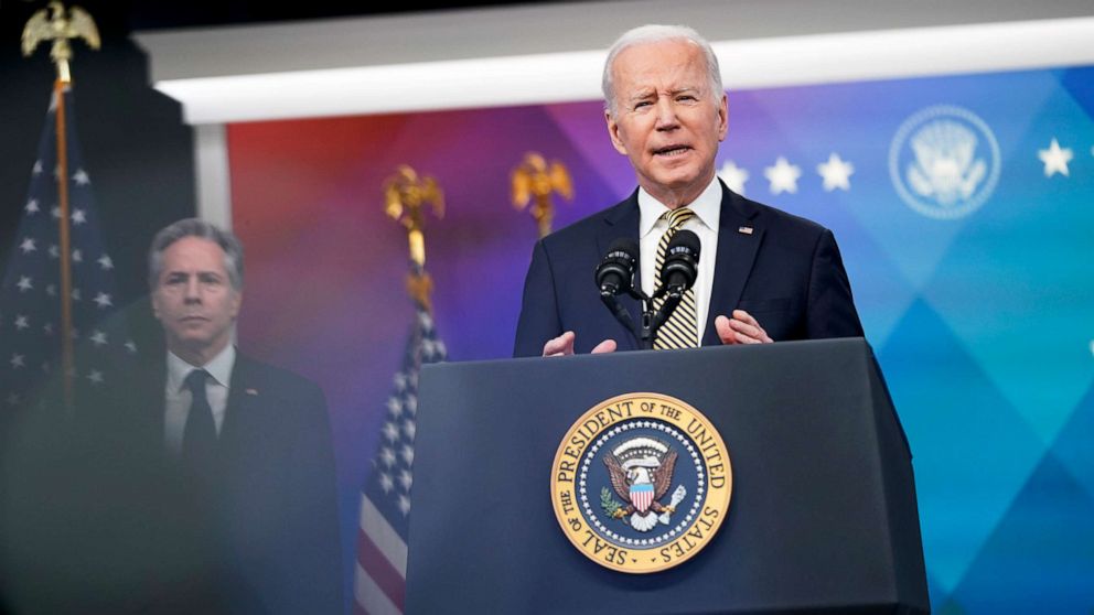 President Joe Biden speaks on the crisis in Ukraine during an event at Eisenhower Executive Office Building near the White House, at rear is Secretary of State Antony Blinken, in Washington, March 16, 2022.