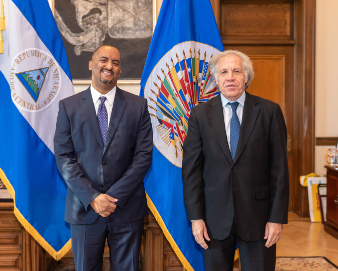 Photograph dated November 5, 2021 provided by the Organization of American States (OAS) showing its secretary general, Luis Almagro (r), while posing with the permanent representative of Nicaragua, Arturo McFields Yescas (L)