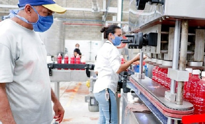 Workers in a beverage manufacturing plant, Venezuela, 2022.