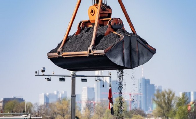 Mechanical shovel lifting coal.