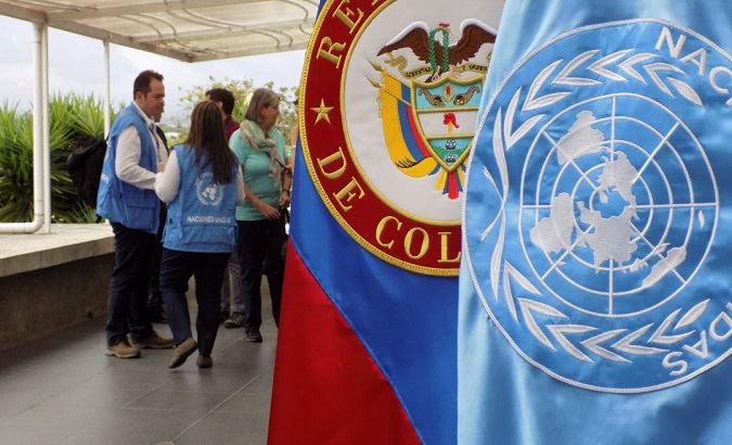 Image of the flags of United Nations and Colombia.