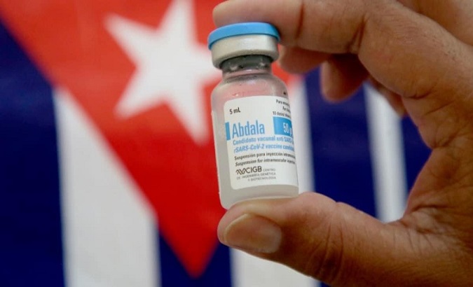 A man loads samples of the Abdala vaccine, Cuba.