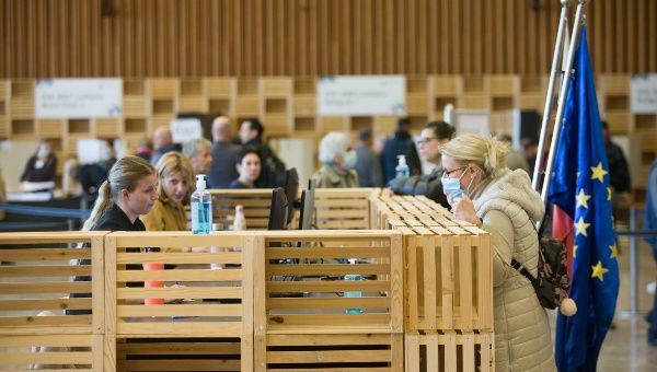 A voter registers during the early voting for 2022 Slovenian parliamentary election at a polling station in Ljubljana, Slovenia, on April 20, 2022. About 1.7 million eligible voters in Slovenia will be invited to cast their ballots on April 24 to elect the country's new Parliament.