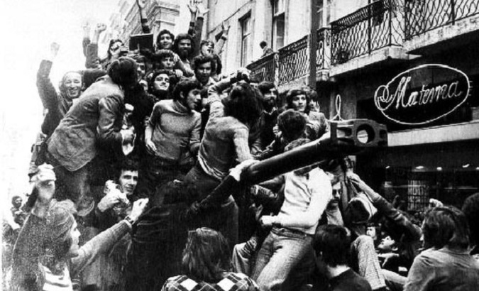 Citizens on top of a tank during protests against the Oliveira Salazar regime, Portugal, April 25, 1974.