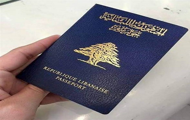 A person holds a Lebanese passport.