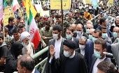 President Ebrahim Raisi (R) in a pro-Palestine demonstration, Iran, April 28, 2022.