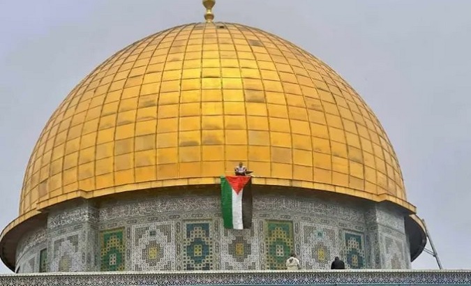 The flag of Palestine on top of the Dome of the Rock in the Al-Aqsa Mosque, 2022.