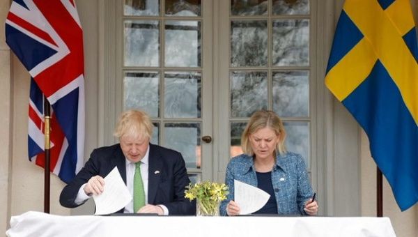 Boris Johnson (L) and Magdalena Andersson (R), Stockholm, Sweden, May 11, 2022.