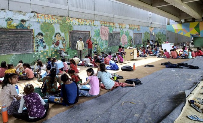 Children at an open-air school, New Delhi, India, May 6, 2022.