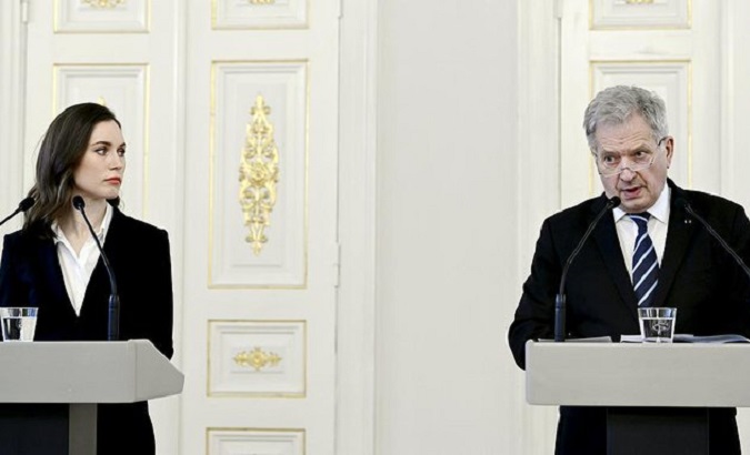 Finnish President Sauli Niinisto (R) and Prime Minister Sanna Marin (L).