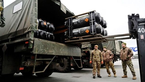 U.S. military men oversee weapons for Ukraine.