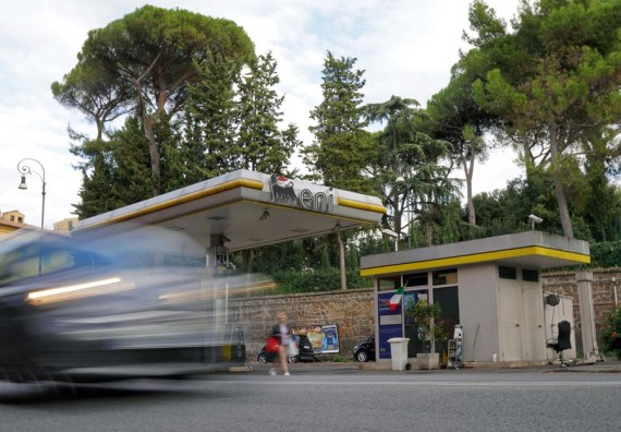 A vehicle passes by a gas station in Rome, Italy, on Oct. 9, 2021.