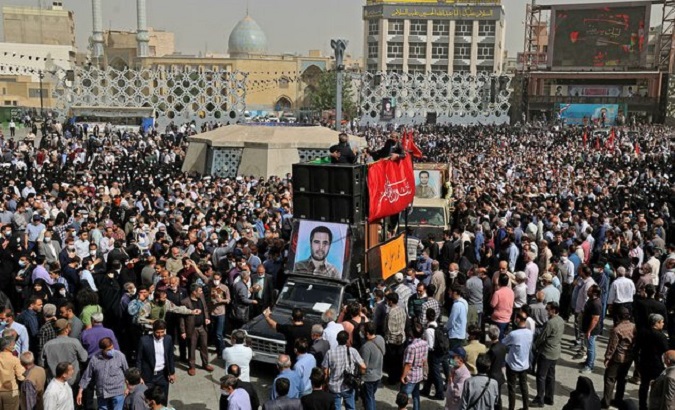Thousands of citizens accompany the funeral procession of Colonel Sayyad Khodai, Tehran, Iran, May 24, 2022.