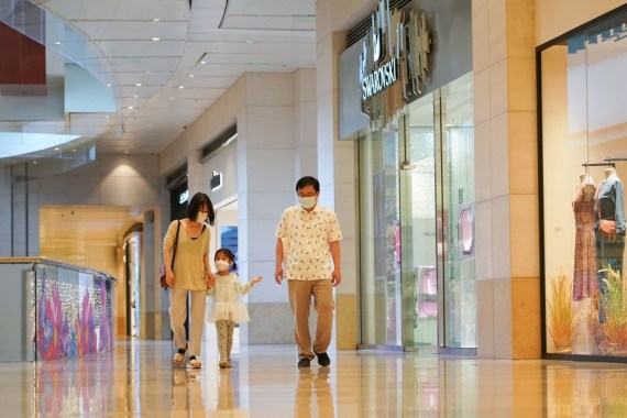 People walk in a department store in Chaoyang District of Beijing, capital of China, May 29, 2022.