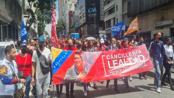 Venezuelan workers march in protest against the exclusion of Venezuela from the Summit of the Americas