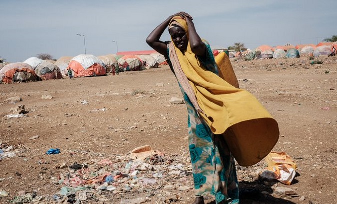 A woman in a makeshift camp for climate refugees. ​​​​​