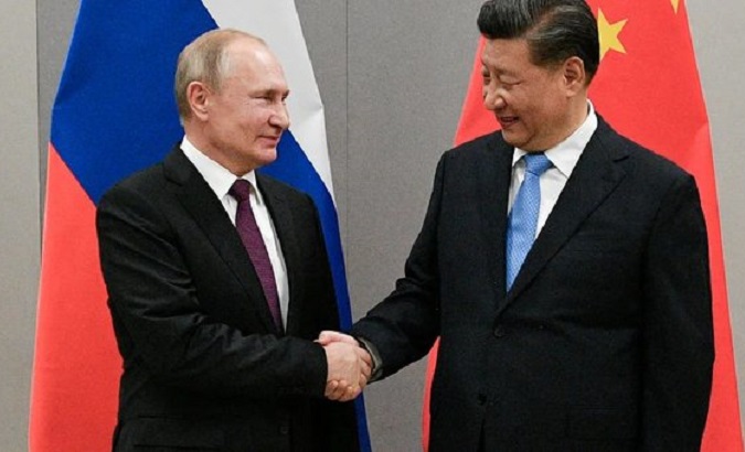 Russian President Vladimir Putin (L) and Chinese President XI Jinping (R).