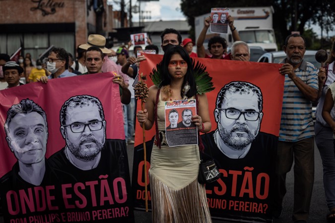 An indigenous woman accompanied by several people marches today during a protest against the disappearance of the indigenous activist Bruno Pereira and the English journalist Dom Phillips in Manaus, Amazonas.