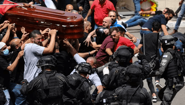 Israeli police attack mourners carrying the coffin of Shireen Abu Akleh, in occupied East Jerusalem, May 13, 2022.