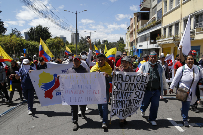 Demonstrators march peacefully today, during the third week of protests in Quito (Ecuador)